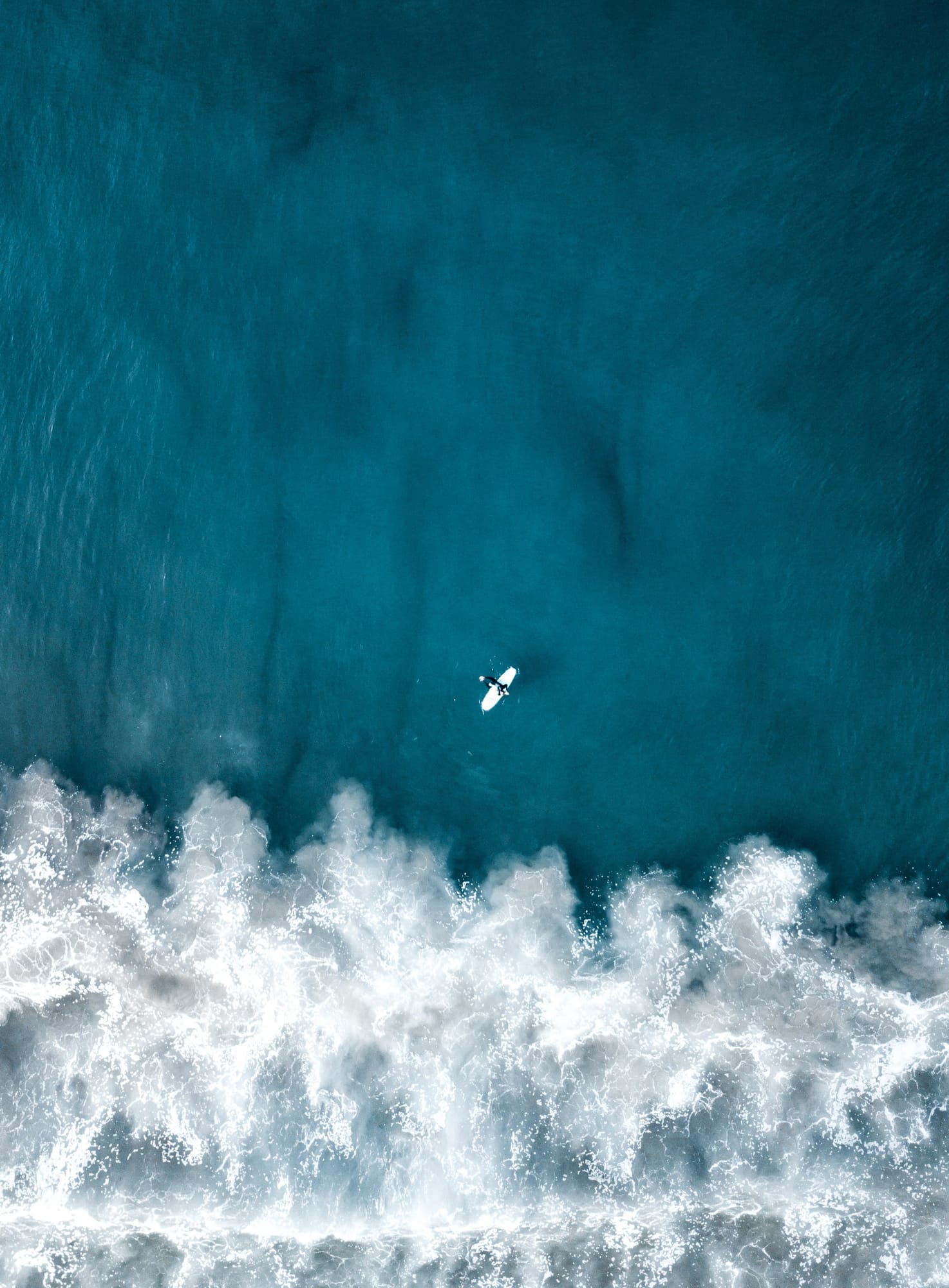 aerial-overhead-vertical-shot-beautiful-ocean-waves-with-plane-flying.jpg